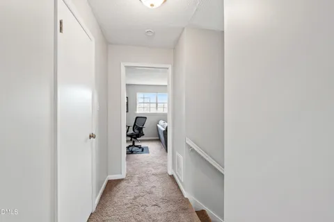 a hall way with a bed