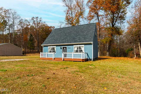 a house with trees in front of it