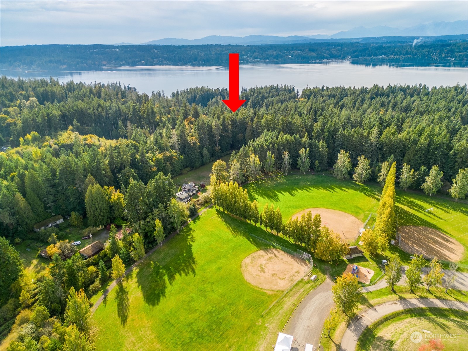 -ne Northeast N Tolo Road Bainbridge Island, WA 98110 - Photo 6 of 12 a view of a lake with a swimming pool