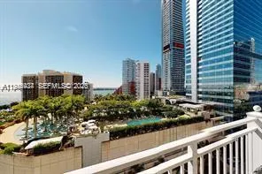 a view of a city from a dining room with large windows