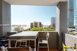 a view of swimming pool with outdoor seating and plants