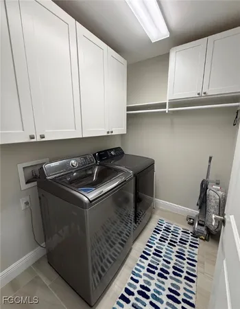 a close view of a sink and cabinets