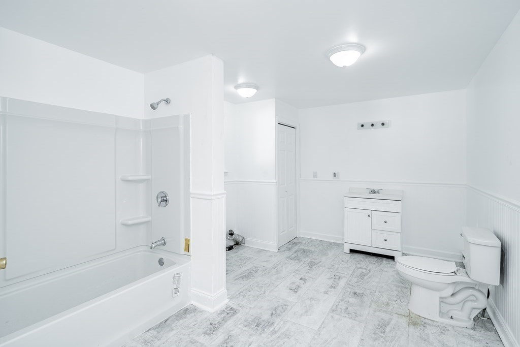 240 Centre Street Springfield, MA 01151 - Photo 6 of 23 a bathroom with a toilet sink and shower