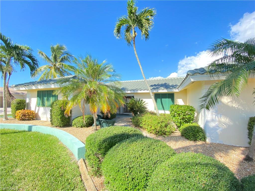 8445 Lagoon Road Fort Myers Beach, FL 33931 - Photo 2 of 30 BRAND NEW TILE ROOF! LOTS OF PALM TREES!