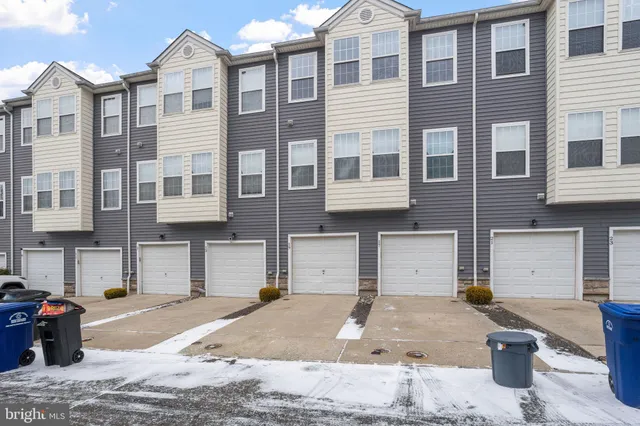 a front view of a building with a road