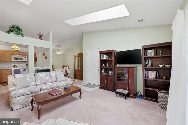 a view of a hallway with seating area