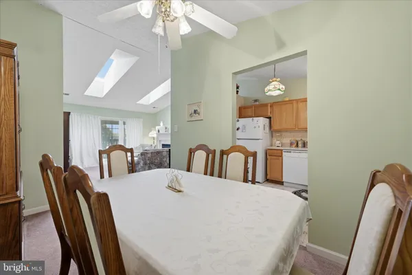 a kitchen with a sink a stove and cabinets