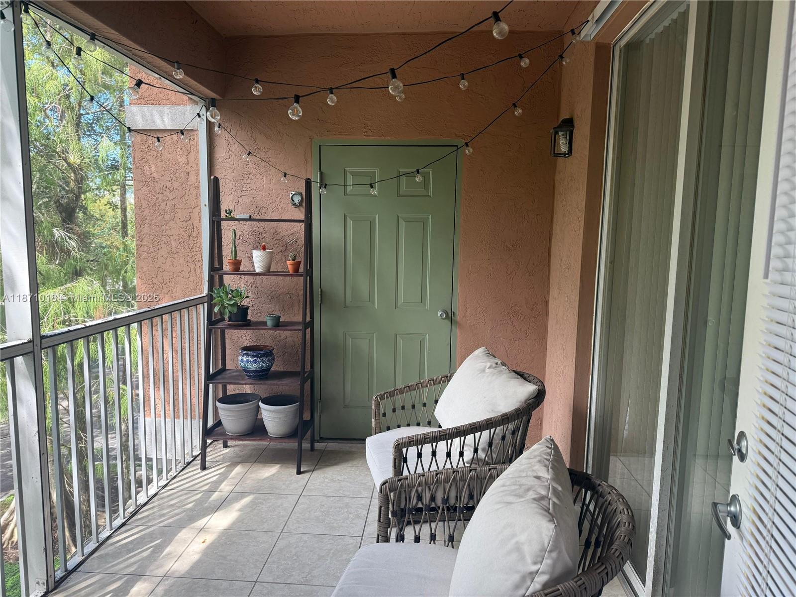 6876 West Sample Road, Unit 6876 Coral Springs, FL 33067 - Photo 1 of 27 a living room with furniture and a window