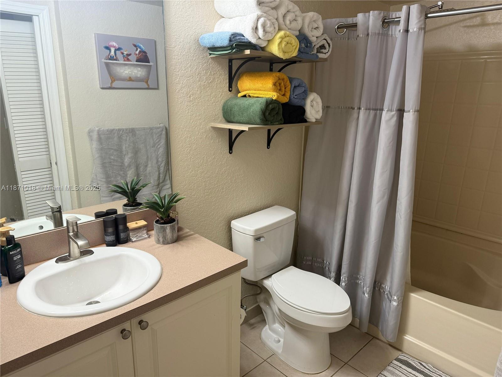 6876 West Sample Road, Unit 6876 Coral Springs, FL 33067 - Photo 13 of 27 a bathroom with a sink toilet and shower