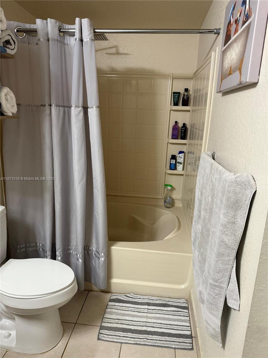6876 West Sample Road, Unit 6876 Coral Springs, FL 33067 - Photo 20 of 27 a bathroom with a toilet and a shower