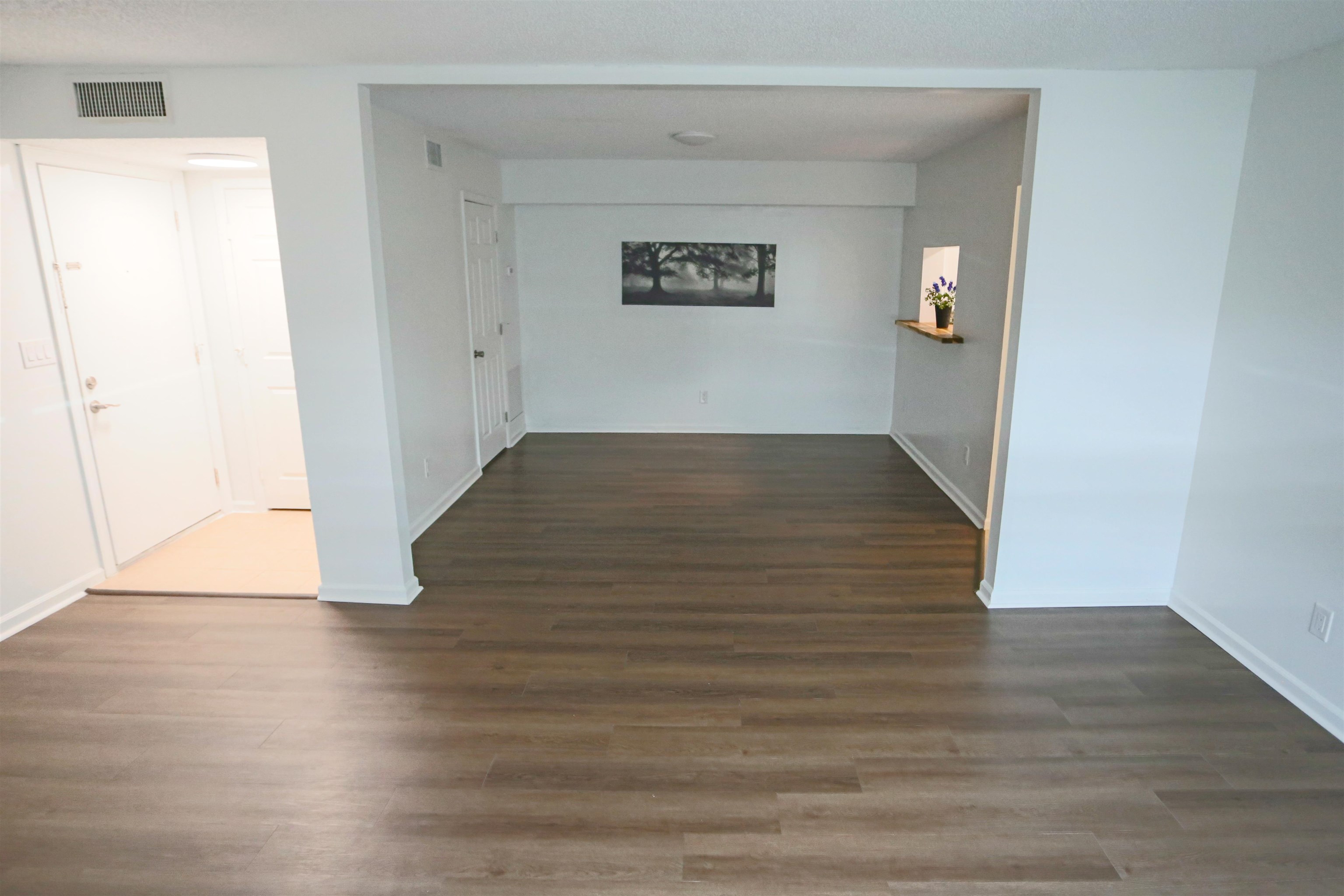 3765 Crown Point Road, Unit 4 Jacksonville, FL 32257 - Photo 11 of 27 an empty room with wooden floor and windows