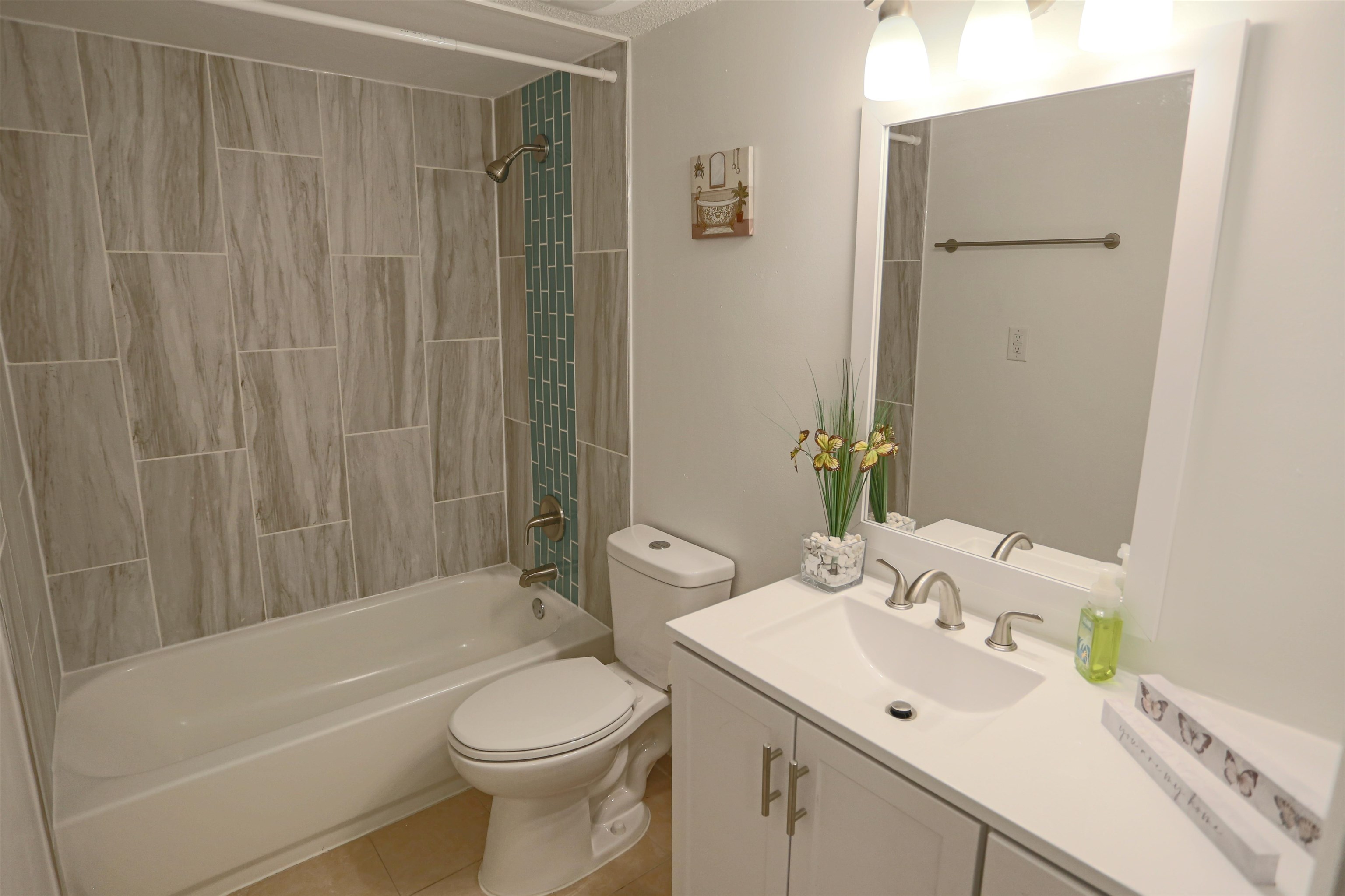 3765 Crown Point Road, Unit 4 Jacksonville, FL 32257 - Photo 22 of 27 a bathroom with a sink a toilet and shower