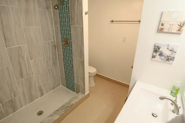 a bathroom with a tub and sink