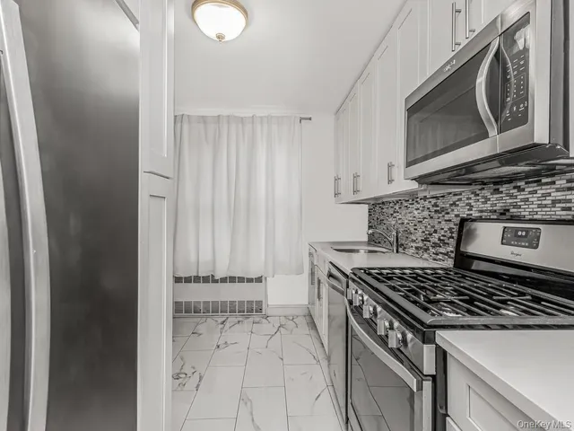 a kitchen with a stove and a microwave