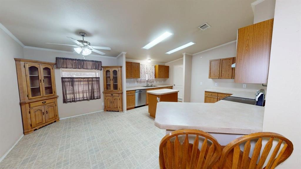 1301 East Pontotoc Street Mason, TX 76856 - Photo 15 of 26 a living room with stainless steel appliances furniture and a kitchen view