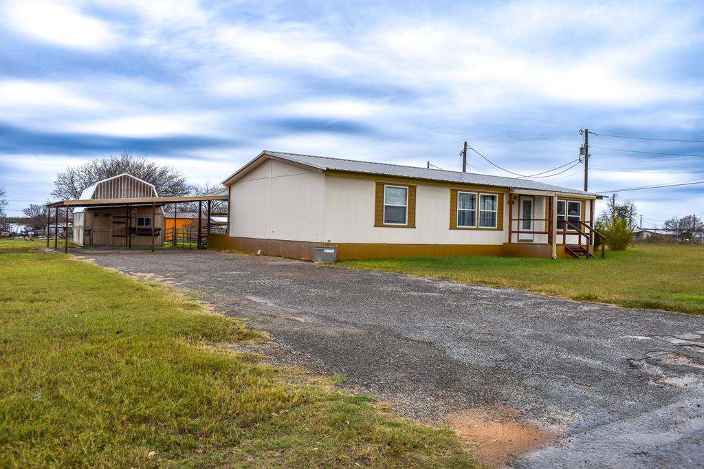 1301 East Pontotoc Street Mason, TX 76856 - Photo 2 of 26 a view of a house with a yard