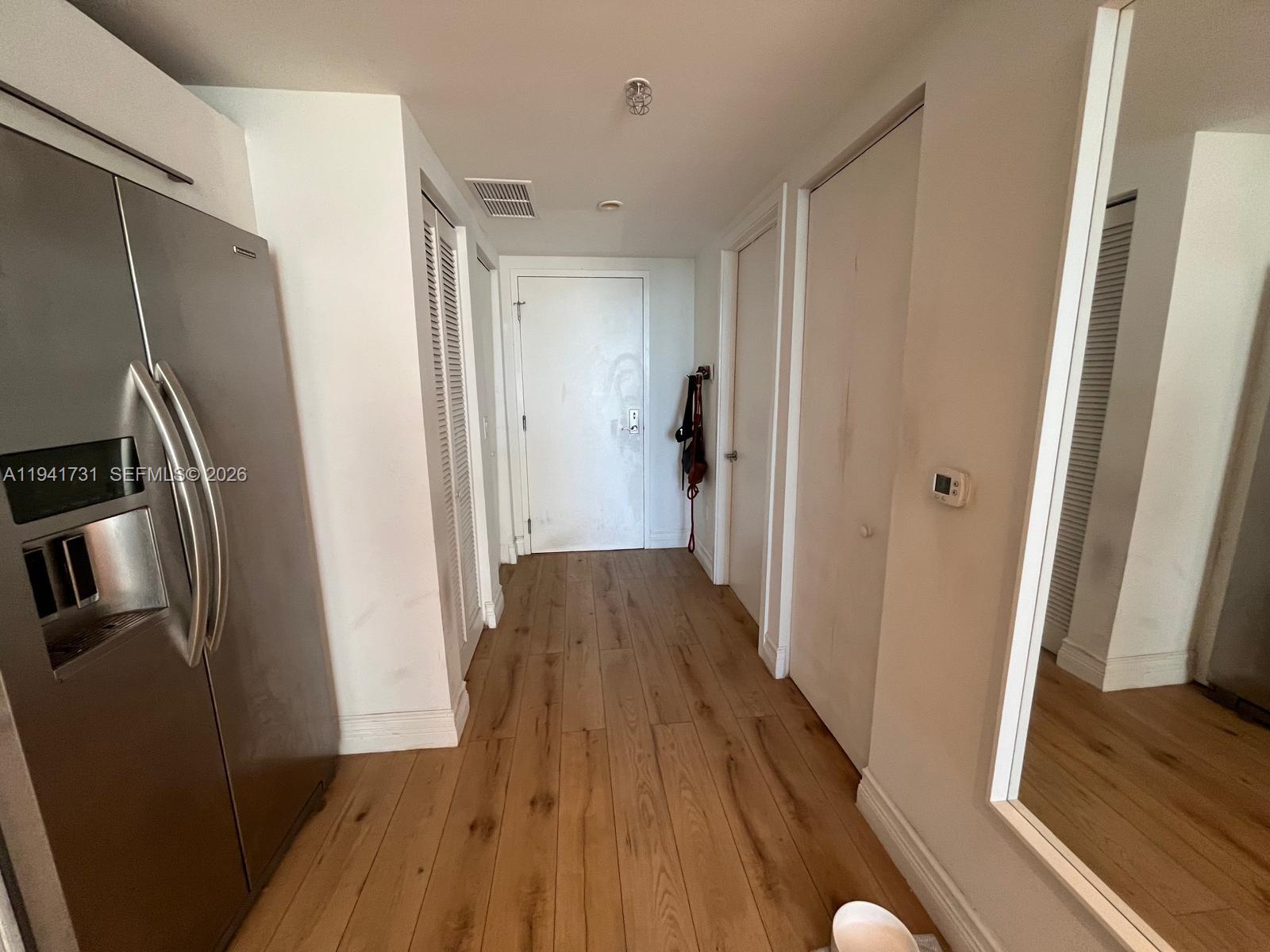 185 Southwest 7th Street, Unit 2006 Miami, FL 33130 - Photo 10 of 14 a view of hallway with wooden floor