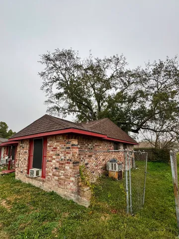 a view of a wooden deck front of house