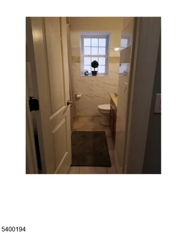 a black and white photo of a bedroom