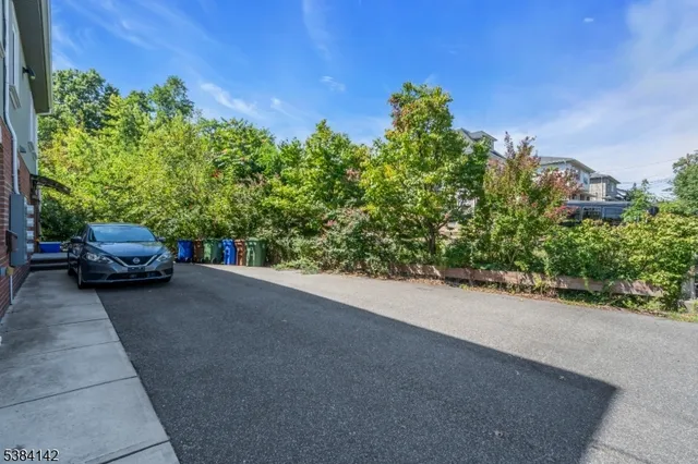 a view of a car parked on the side of the road