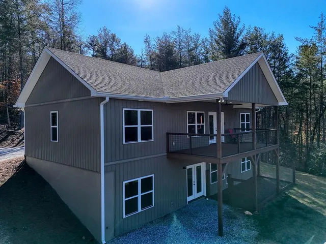a aerial view of a house yard and mountain view