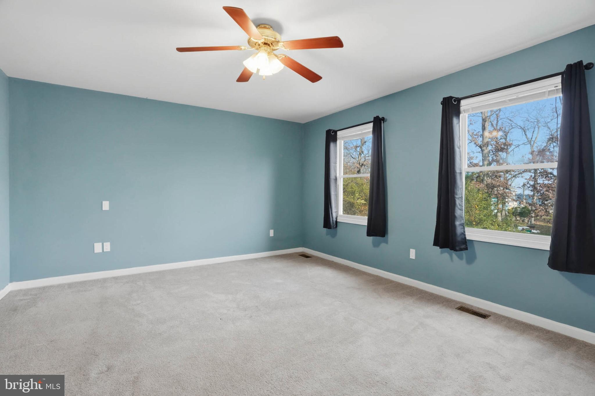 4742 Chestnut Road Shady Side, MD 20764 - Photo 17 of 41 Bright and airy bedroom with serene views.