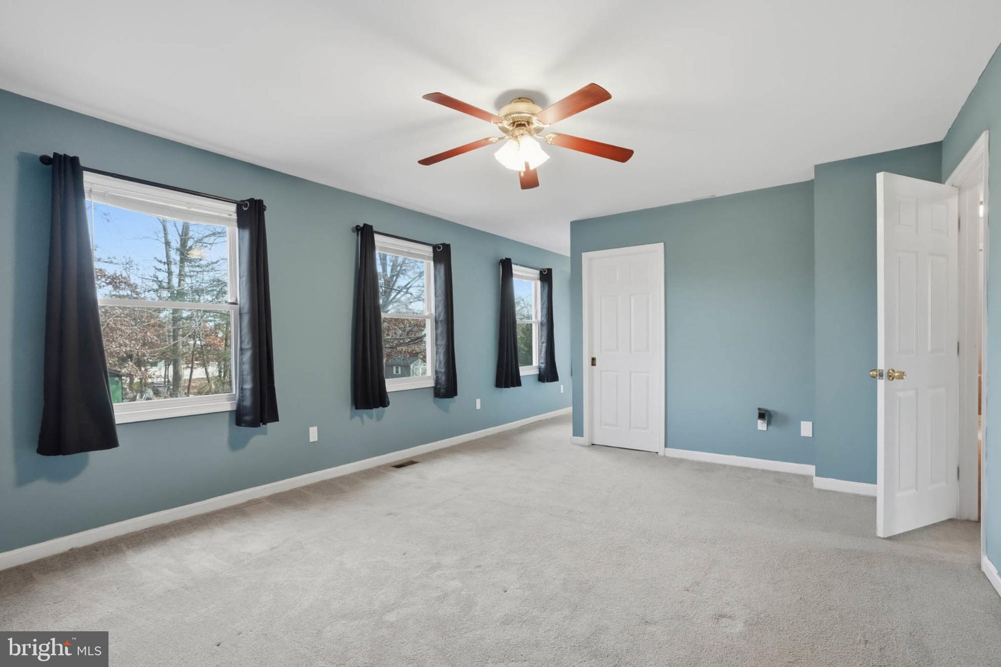 4742 Chestnut Road Shady Side, MD 20764 - Photo 18 of 41 Spacious room with serene blue walls.