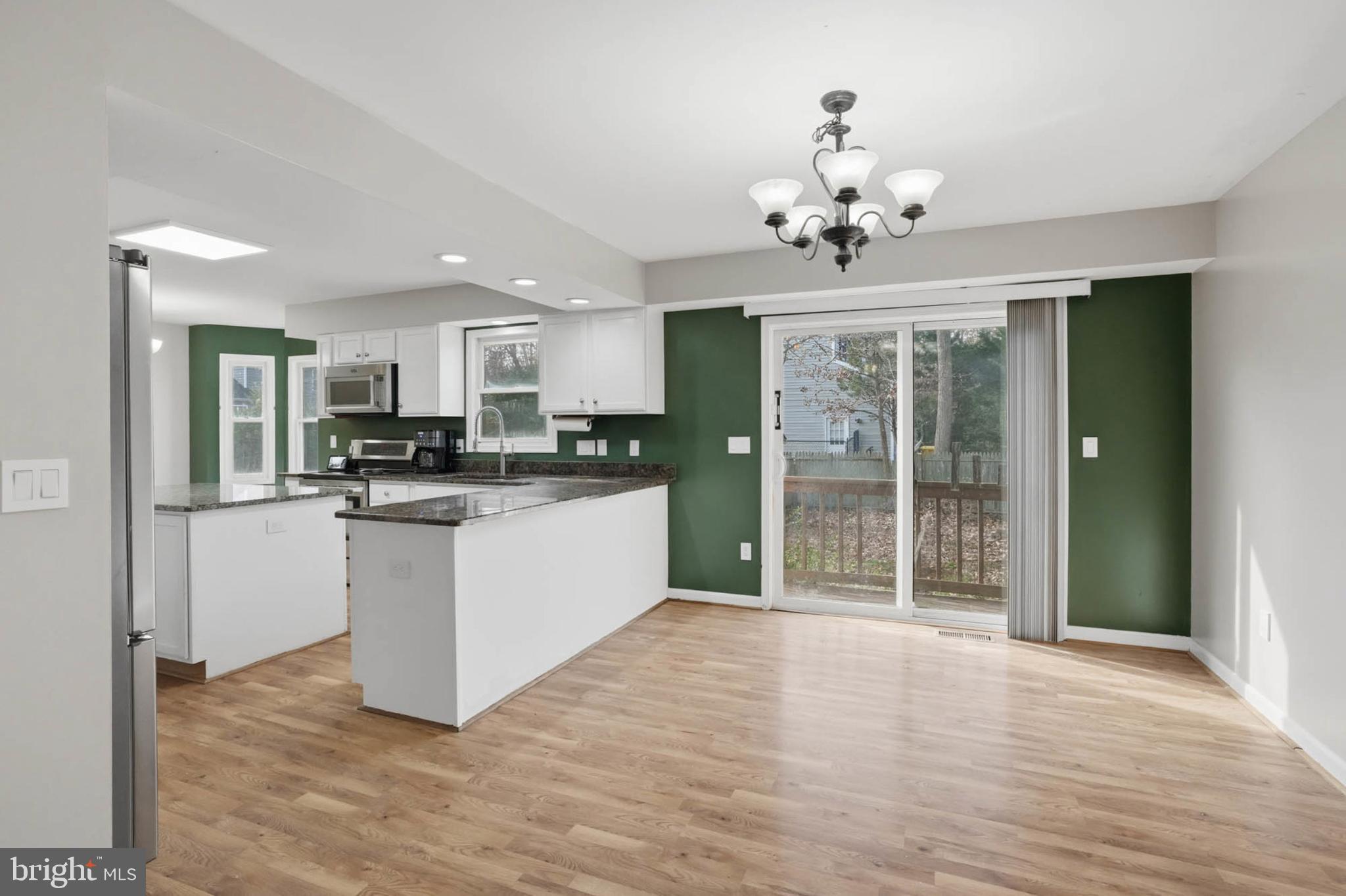 4742 Chestnut Road Shady Side, MD 20764 - Photo 10 of 41 Modern kitchen with inviting outdoor access.