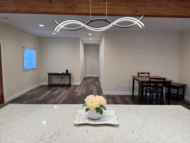 a view of a livingroom with furniture and wooden floor