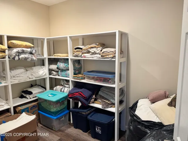 a bedroom with a bed and a closet