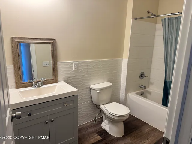 a bathroom with a toilet a sink and a bathtub