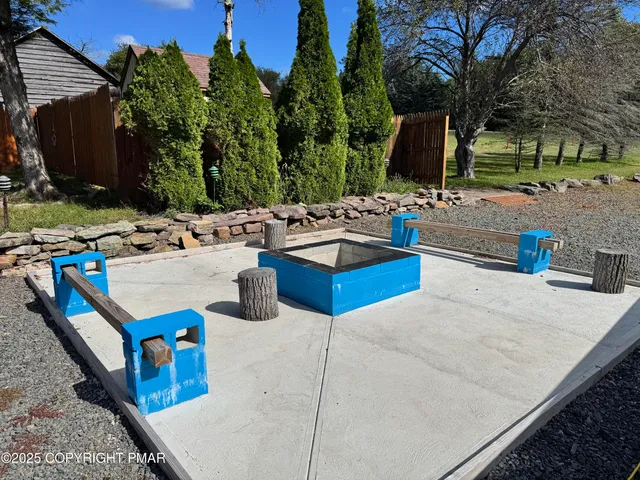 a view of a kitchen with kitchen island and a stove