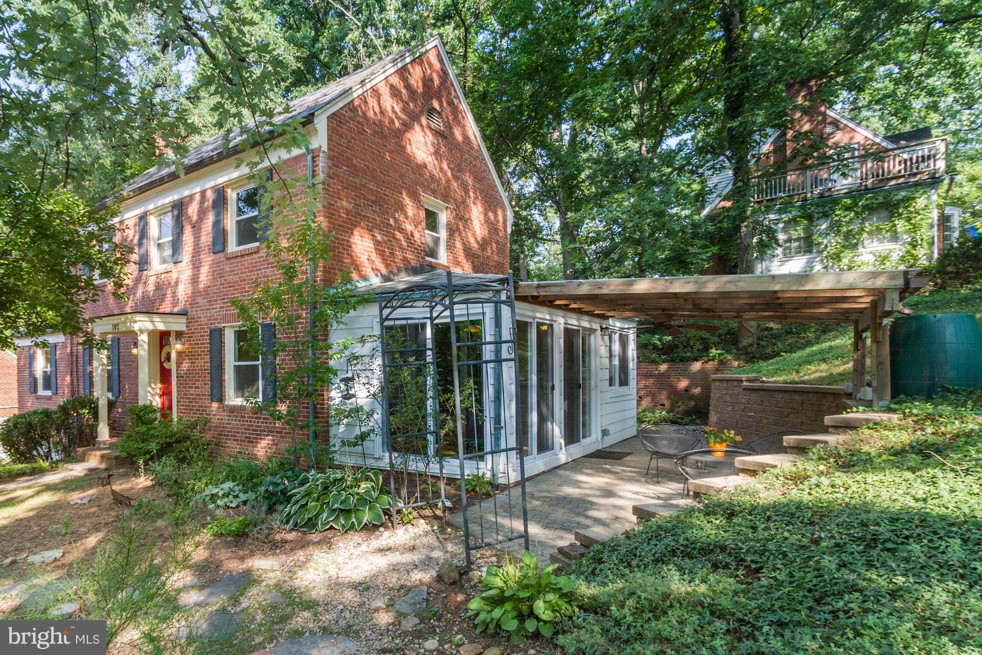 102 Wayne Avenue Silver Spring, MD 20901 - Photo 12 of 29 a backyard of a house with plants and outdoor seating