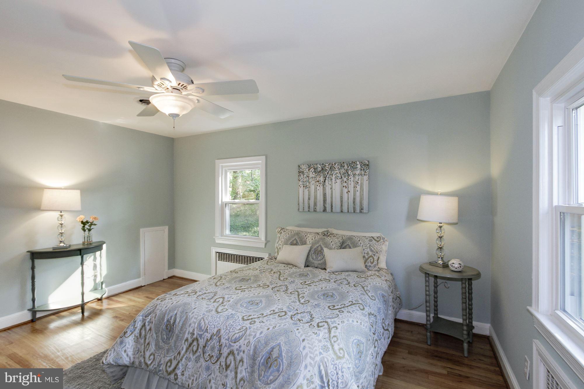 102 Wayne Avenue Silver Spring, MD 20901 - Photo 17 of 29 a bedroom with a bed and a window
