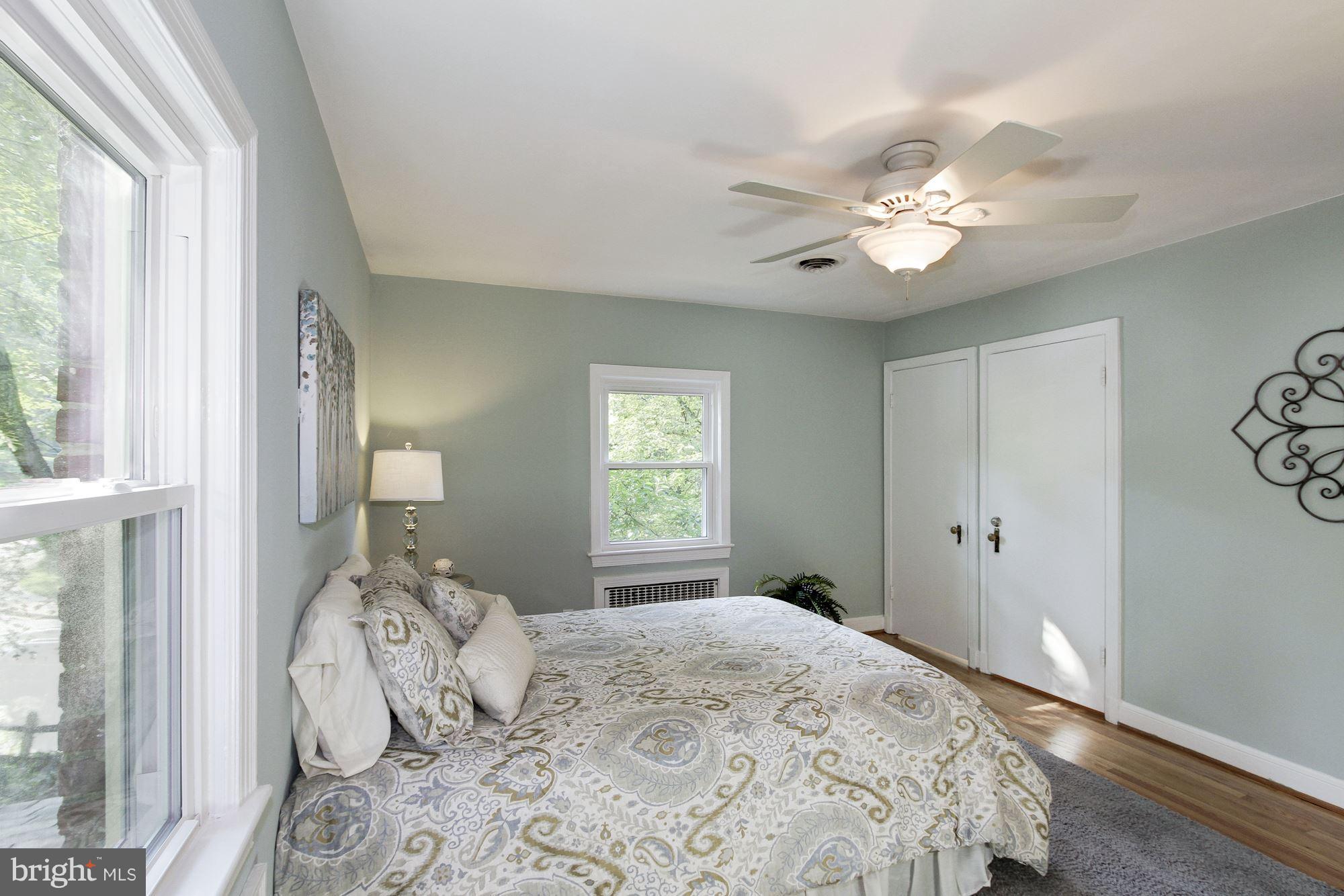 102 Wayne Avenue Silver Spring, MD 20901 - Photo 18 of 29 a bedroom with a large bed and a window