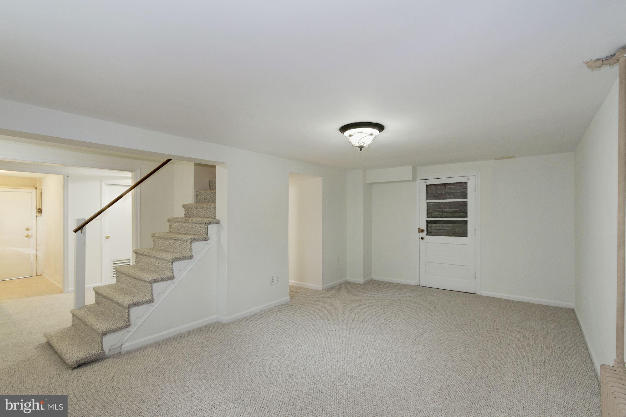 102 Wayne Avenue Silver Spring, MD 20901 - Photo 25 of 29 a view of an empty room with stairs