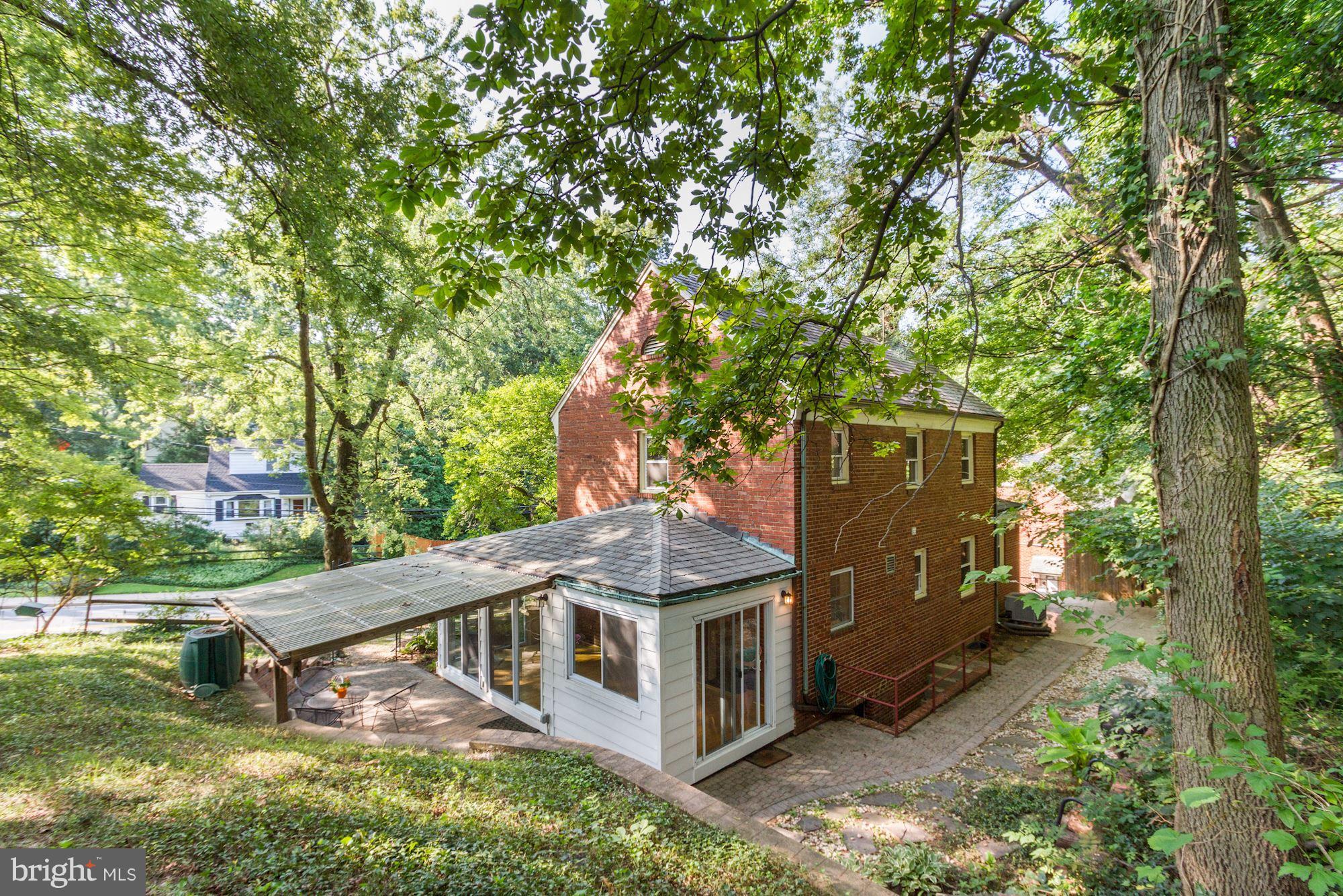 102 Wayne Avenue Silver Spring, MD 20901 - Photo 28 of 29 a view of a house with a yard deck and a garden