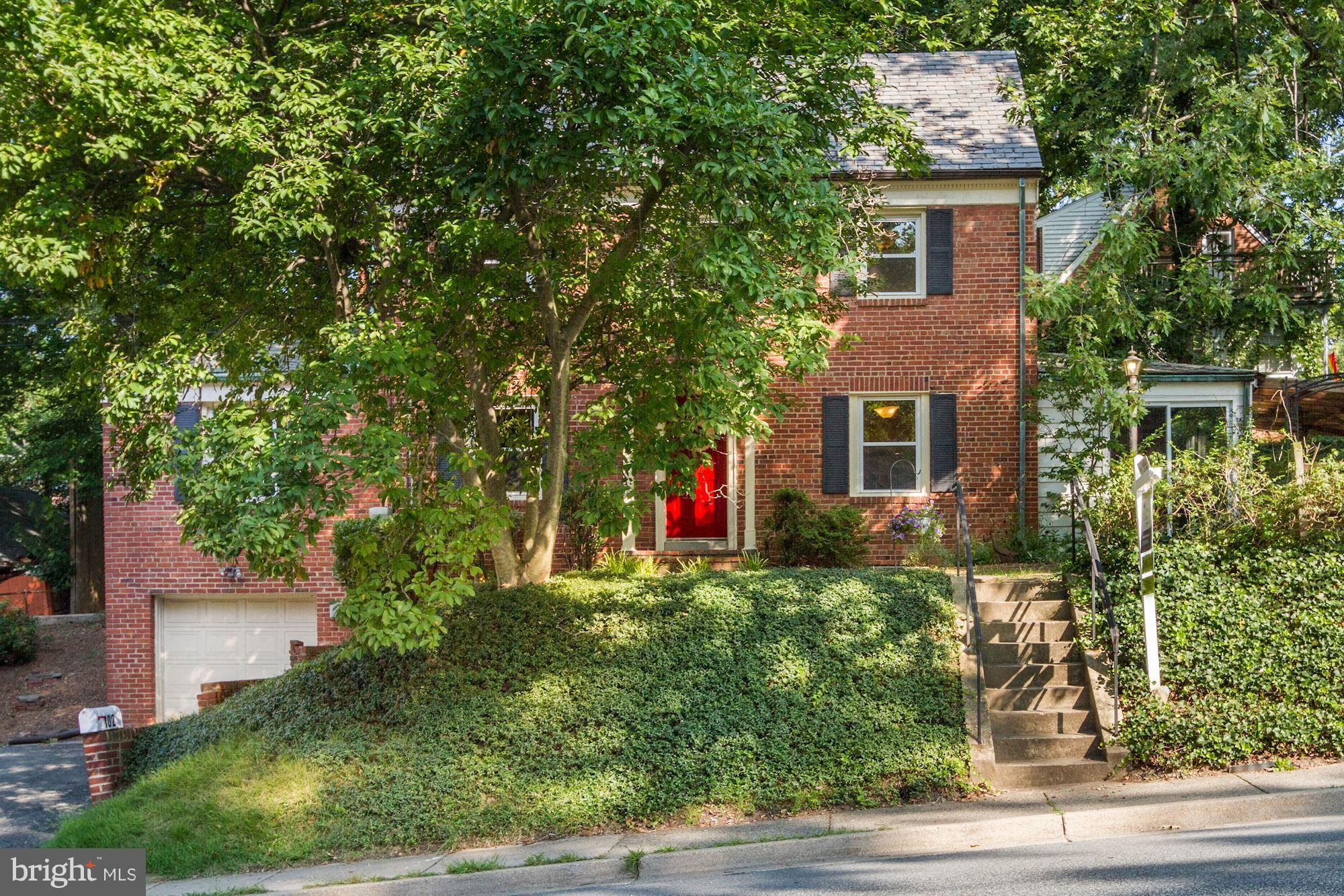 102 Wayne Avenue Silver Spring, MD 20901 - Photo 29 of 29 a front view of a house with a yard and garage