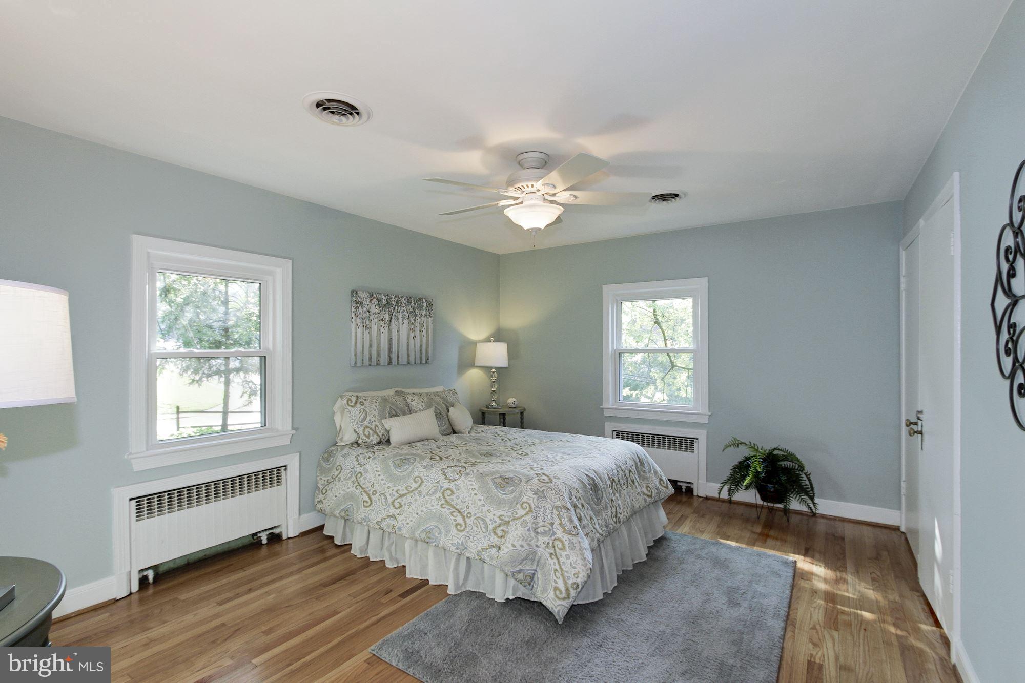 102 Wayne Avenue Silver Spring, MD 20901 - Photo 8 of 29 a bedroom with a large bed and a window