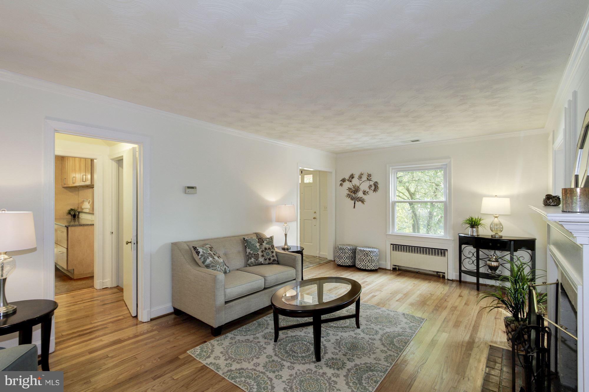 102 Wayne Avenue Silver Spring, MD 20901 - Photo 9 of 29 a living room with furniture and a wooden floor