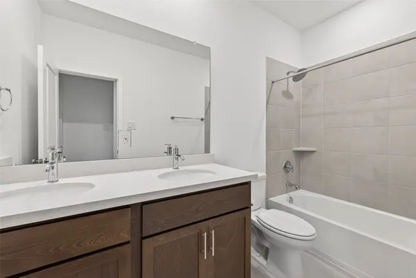 a bathroom with a sink a toilet and a bathtub