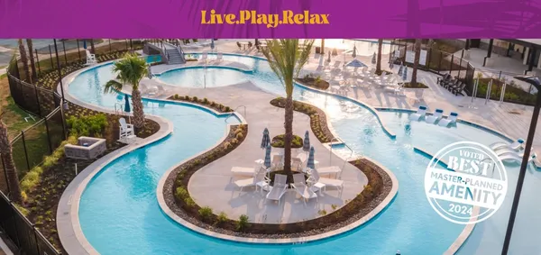 a picture of swimming pool with a glass top table and chairs