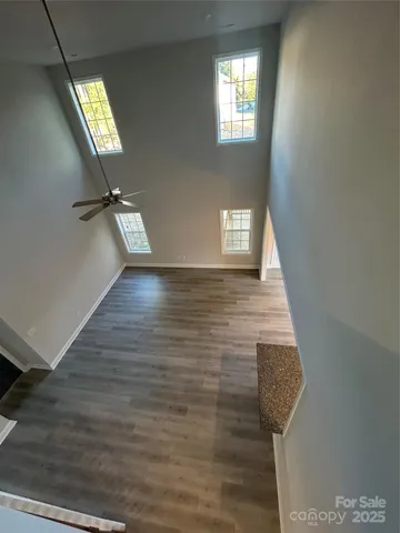 a view of an entryway with wooden floor