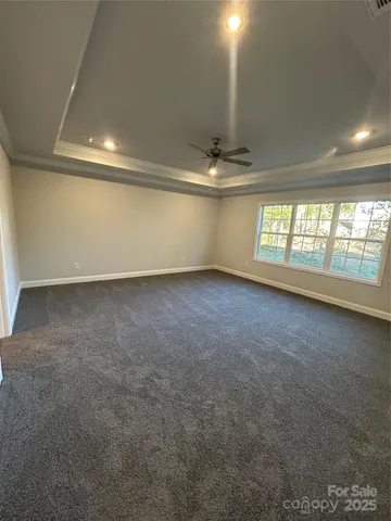 an empty room with a empty space and windows