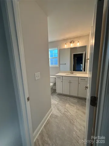 a view of a kitchen with a sink