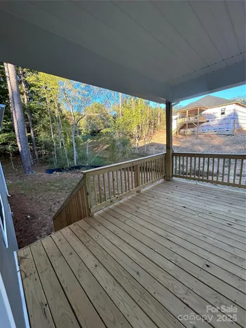 a view of balcony with wooden floor
