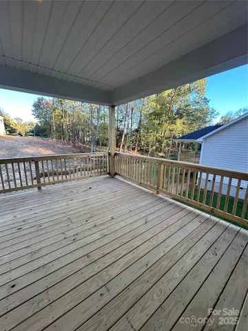 a view of balcony with wooden floor