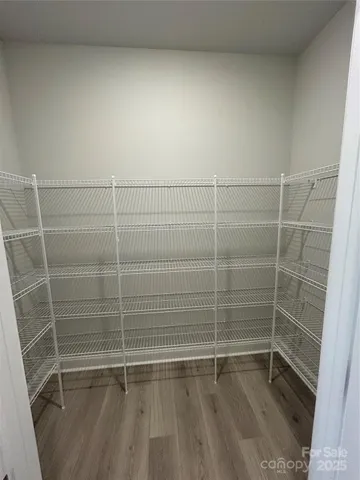 a bathroom with a wooden toilet