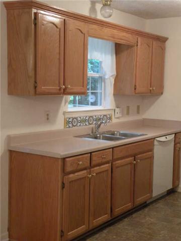 4754 Campbell Road Cross Plains, TN 37049 - Photo 11 of 20 a kitchen with stainless steel appliances granite countertop a sink and cabinets