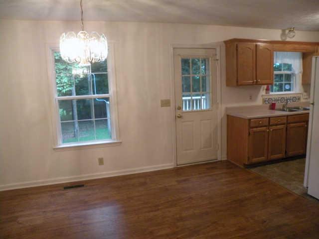 4754 Campbell Road Cross Plains, TN 37049 - Photo 13 of 20 an empty room with wooden floor and windows